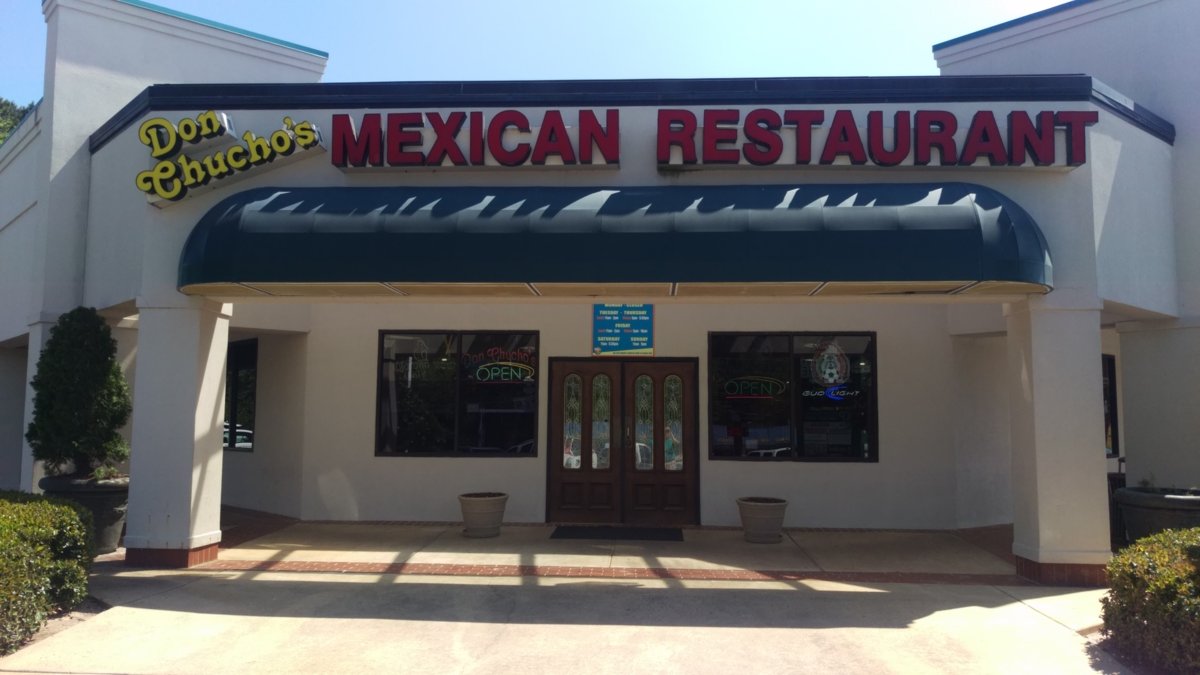 Storefront of the original Don Chucho's Mexican Restaurant with a green awning